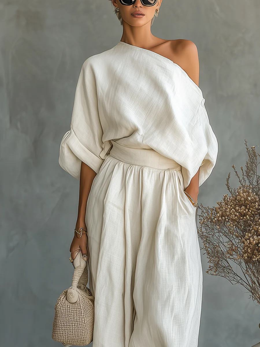 Célène™ – Set consisting of a relaxed, loose off-shoulder top in off-white linen and tapered pants.